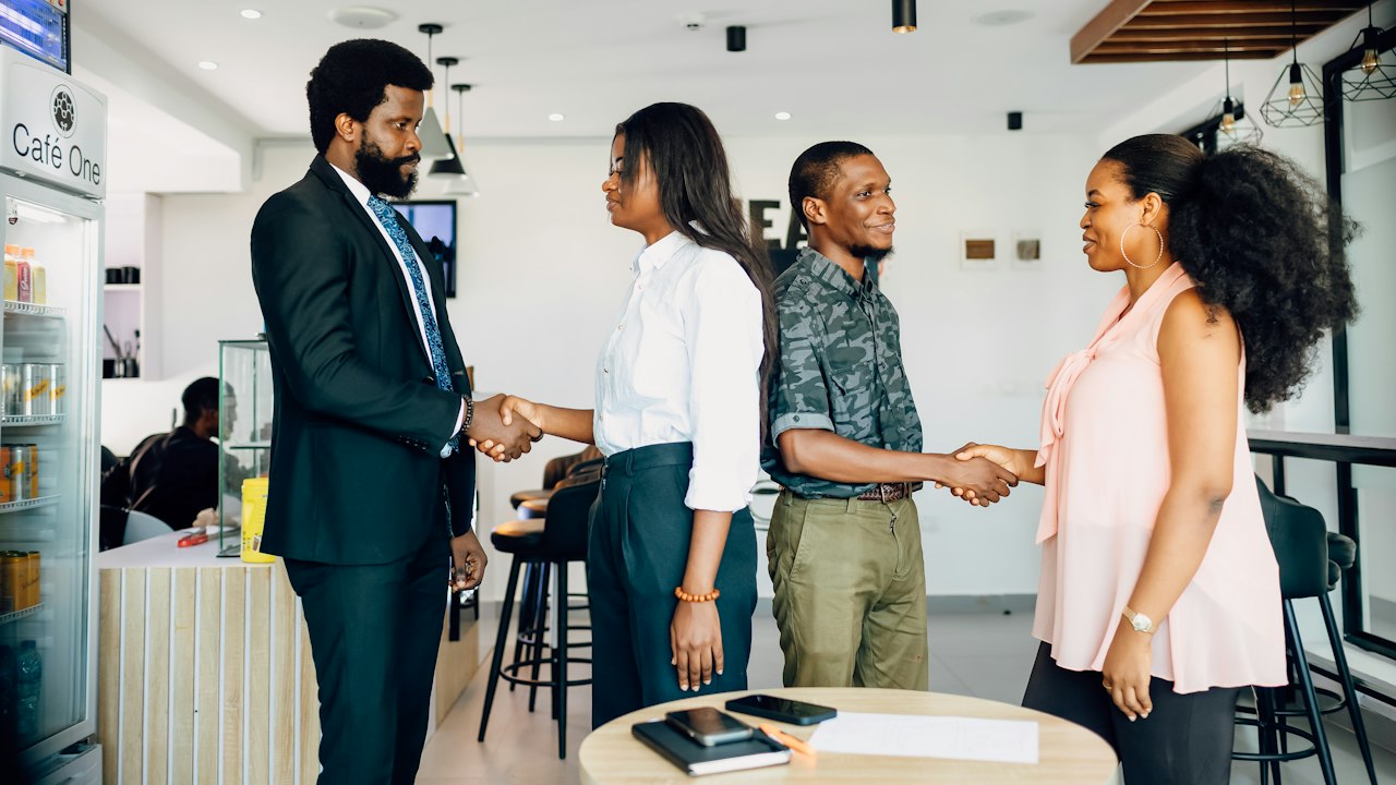 Travel professionals meeting and shaking hands
