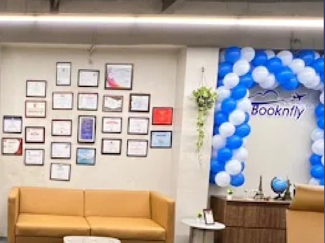 The Booknfly office in Surat, with its wall of certificates and awards